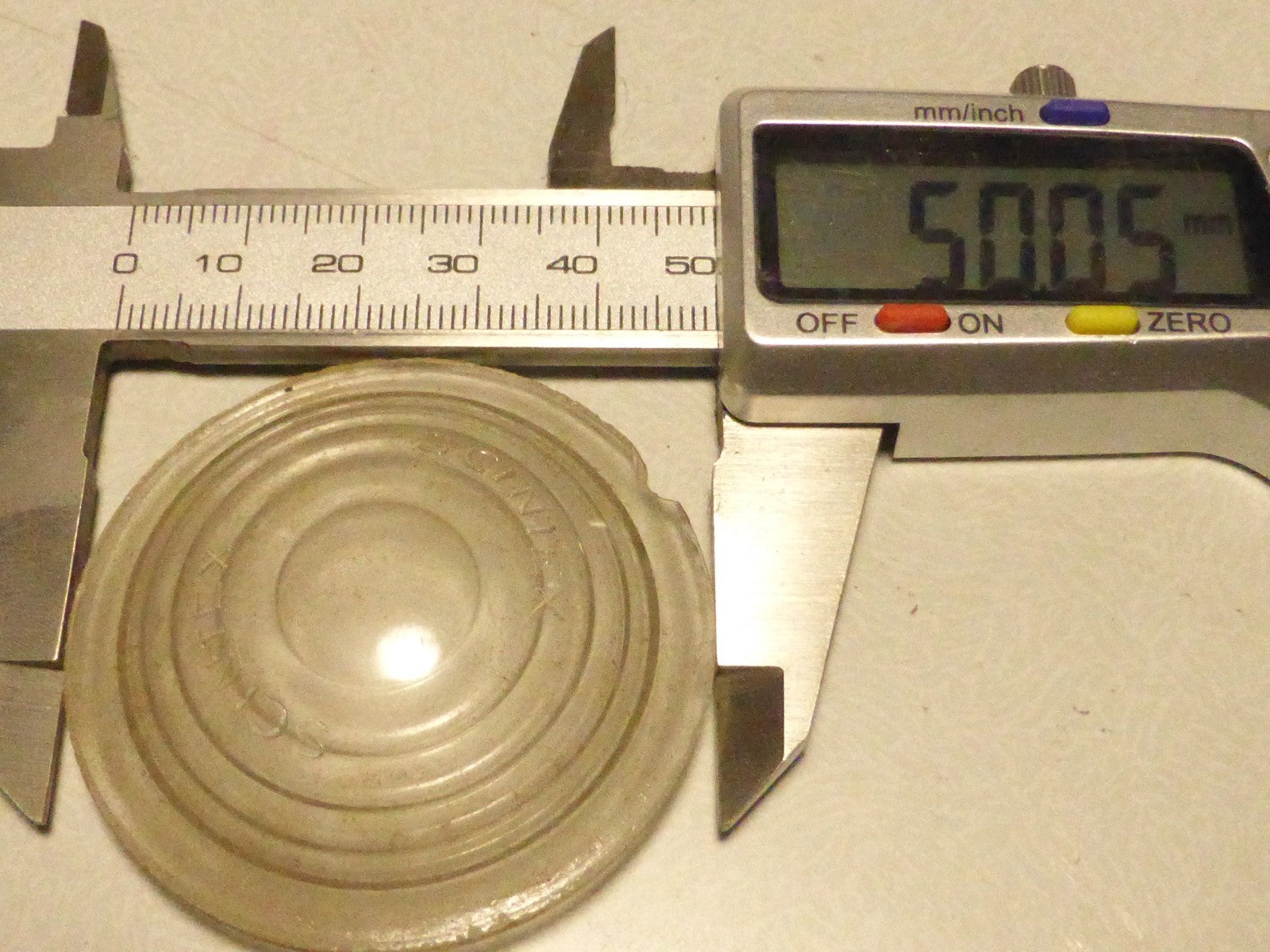 Ancien Cabochon en verre transparent SCINTEX 50 mm Ø velo moto auto tacot